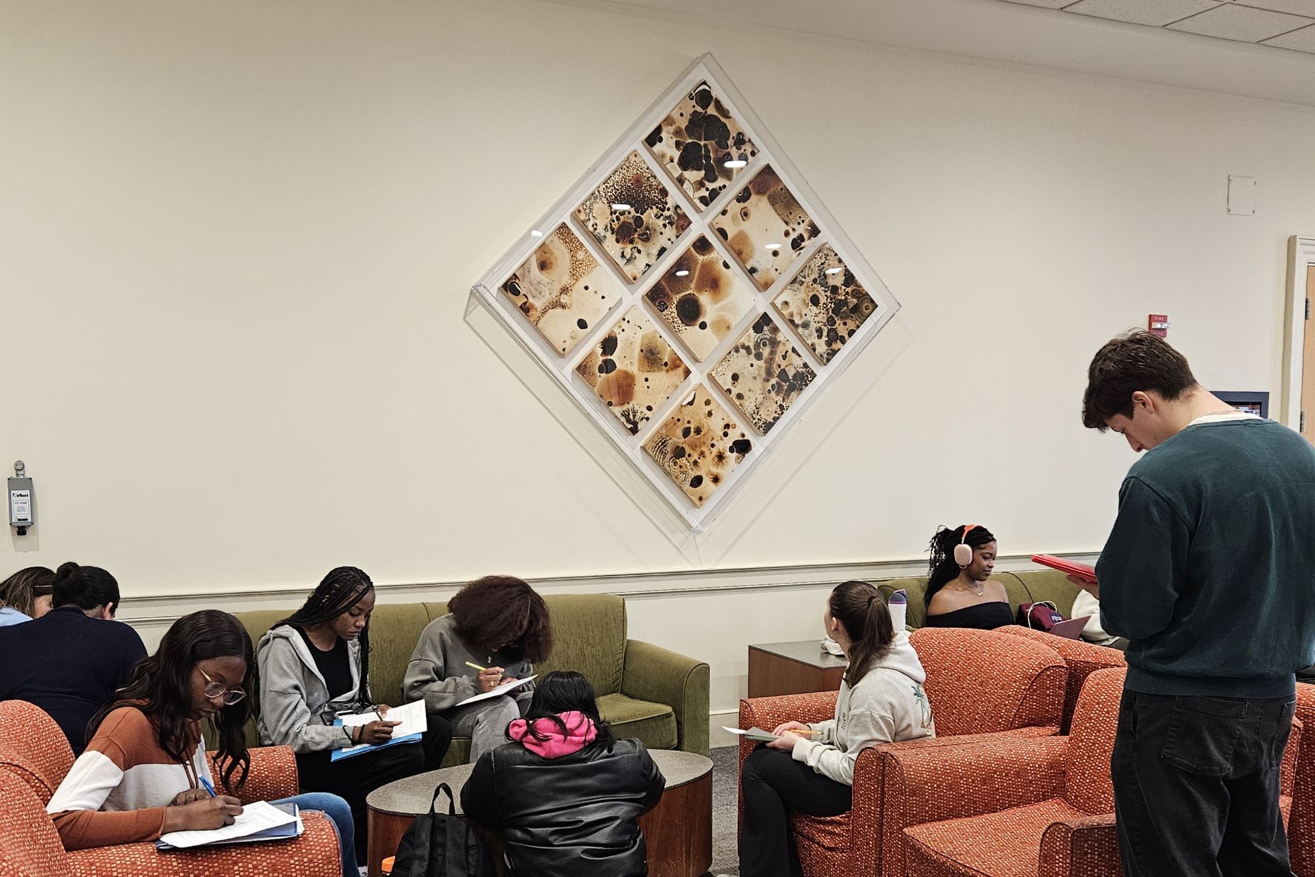 students looking at art and taking notes