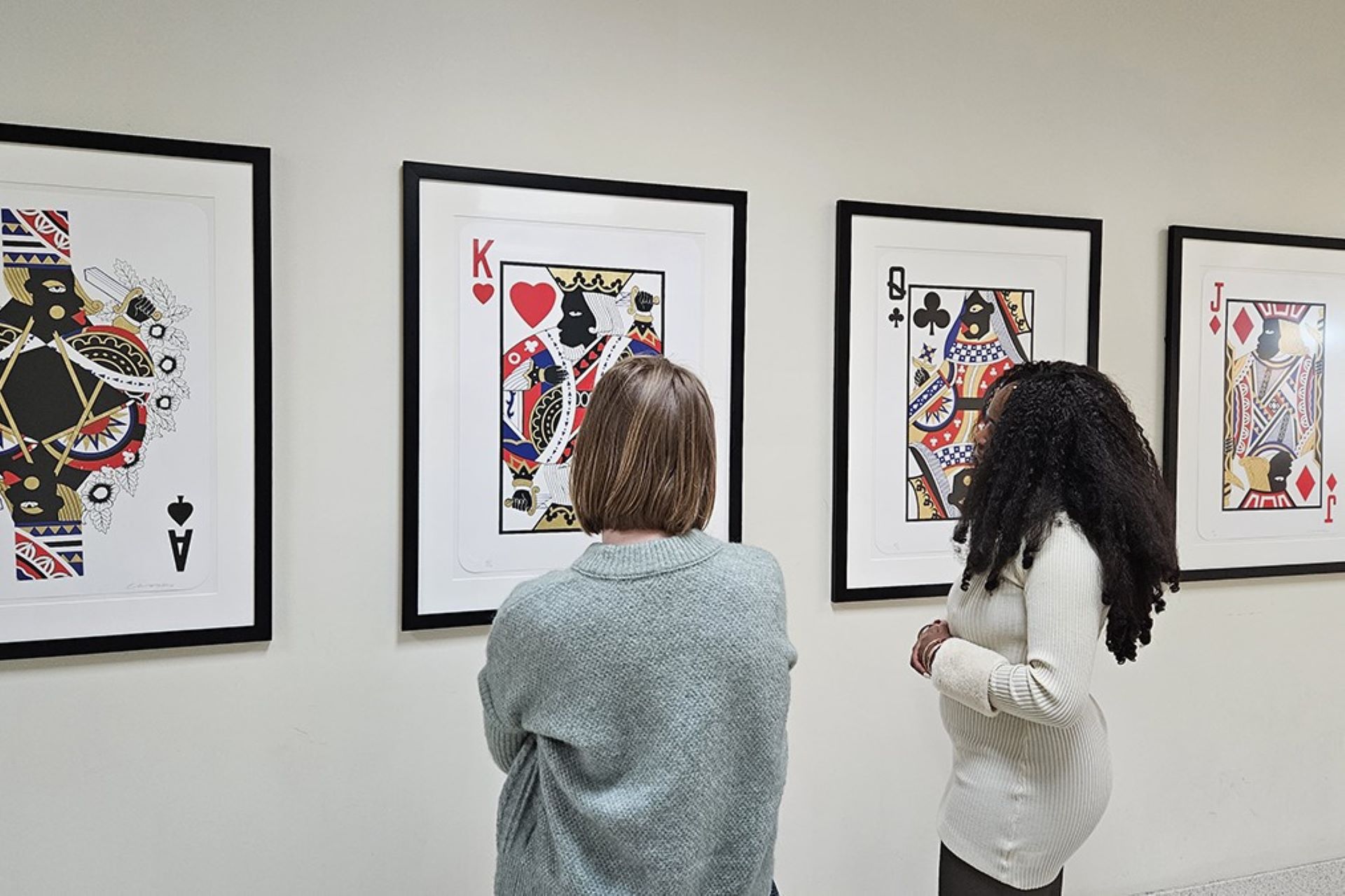 two people looking at art