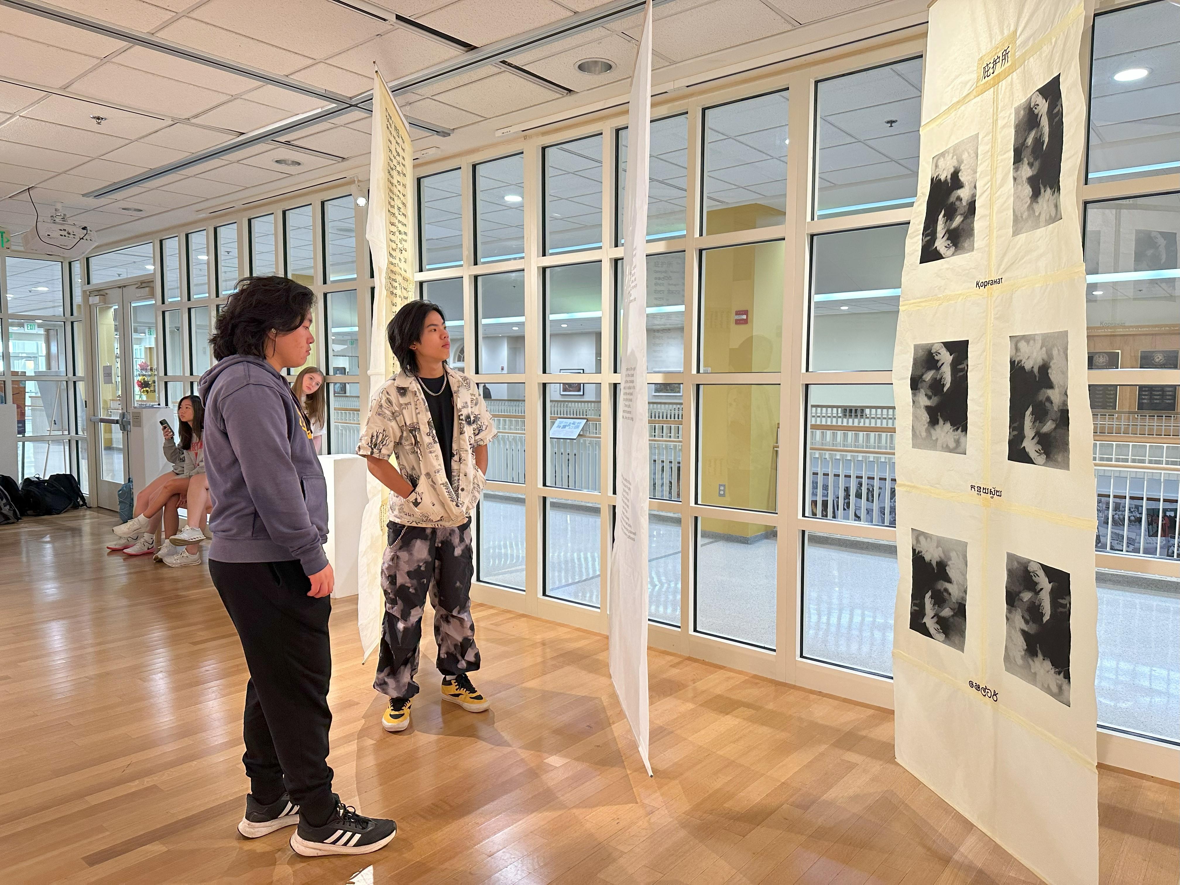 two people looking at art in the Stamp Gallery